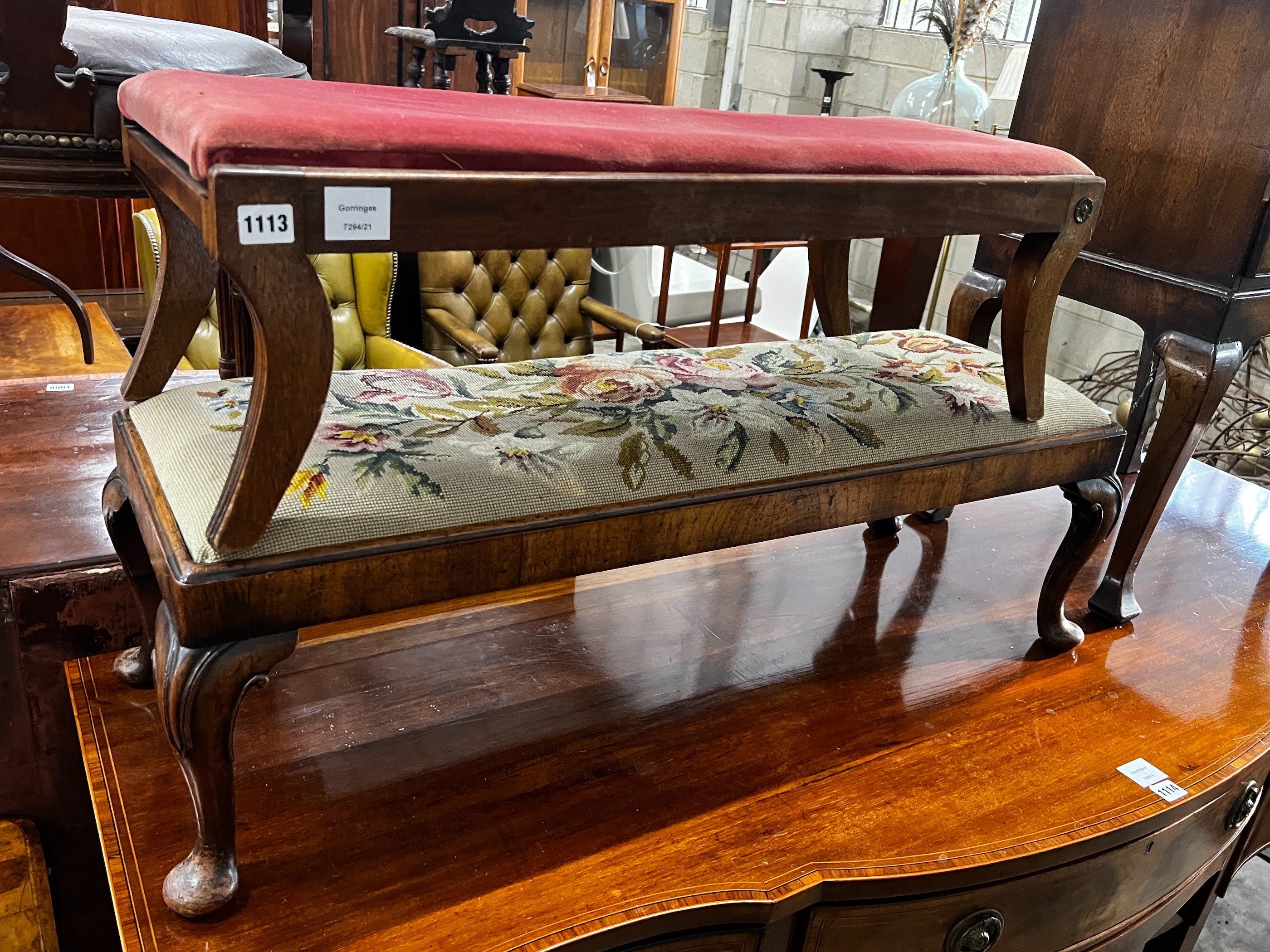 A George I style mahogany fender stool with a floral tapestry top length 101cm, height 33cm together with a smaller fender stool